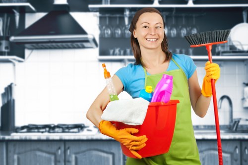 Staff using protective procedures while handling cleaning chemicals and wet flooring