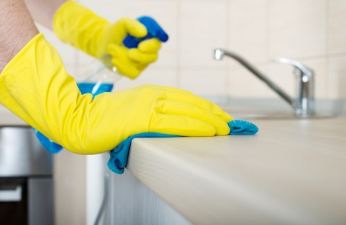 Cleaning technician managing equipment and safety checks before starting carpet treatment